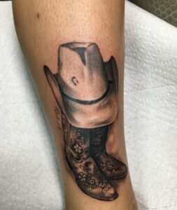 Hat And Boots Memorial Tattoo